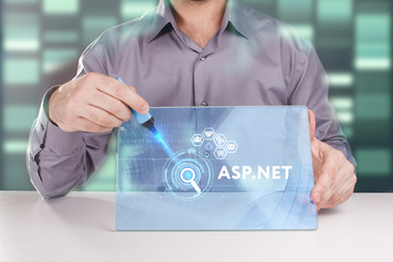 The concept of business, technology, the Internet and the network. A young entrepreneur working on a virtual screen of the future and sees the inscription: ASP.NET