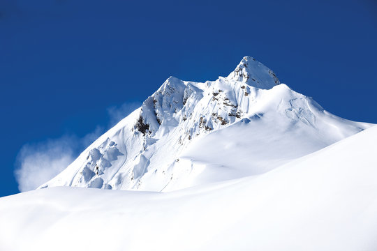 Winter mountain with white snow peak in France