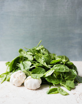 Fresh spinach leaves and garlic
