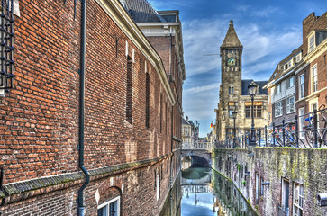 Narrow section of the Nieuwe Gracht (New Canal), with brick walls on both sides, in the old center of Utrecht, the Netherlands