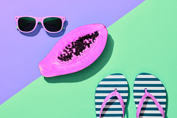 Papaya Tropical Fruit. Bright Sweet Color. Flat lay. Hot Summer Vibes. Trendy fashion Accessories Set. Minimal Style. Neon papaya, Sunglasses on Purple