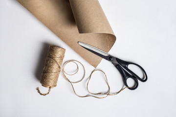 Packing set of binder twine, scissors and craft paper