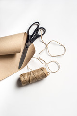 Packing set of binder twine, scissors and craft paper