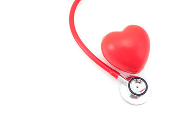 Stethoscope and red heart on white background