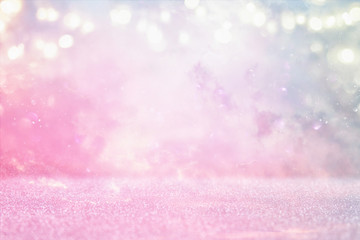 glitter vintage lights background. pink and purple. de-focused.