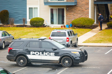 Police car parked in neighborhood