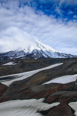 Mountain landscape: view on active Koryaksky Volcano on a sunny day. Koryaksky-Avachinsky Group of Volcanoes, Kamchatka Peninsula, Russia, Far East