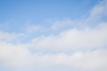Blue sky with white clouds in the winter air