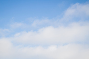 Blue sky with white clouds in the winter air