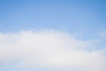 Blue sky with white clouds in the winter air