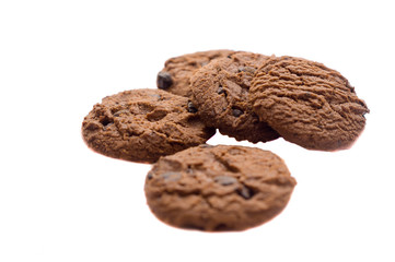 several pieces of cooky in strange pile on white background