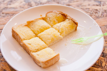 toast bread bake with honey on the plate