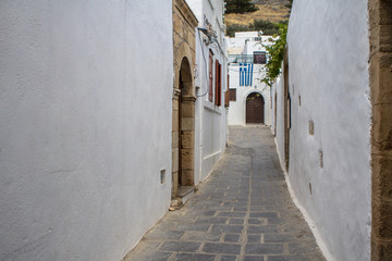 Fototapeta na wymiar Narrow street in Lindos, Rhodes Island, Greece