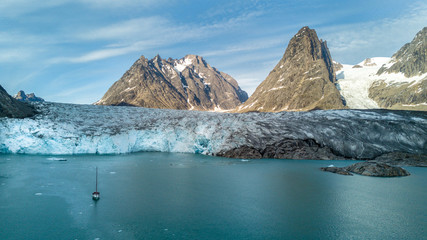 Yacht, glacier and mountain. Powerfull of nature.