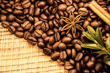 Coffe beans texture with cinnamon, dry orang and copyspace