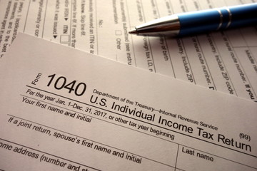 Blank 1040 tax return form, financial taxation concept