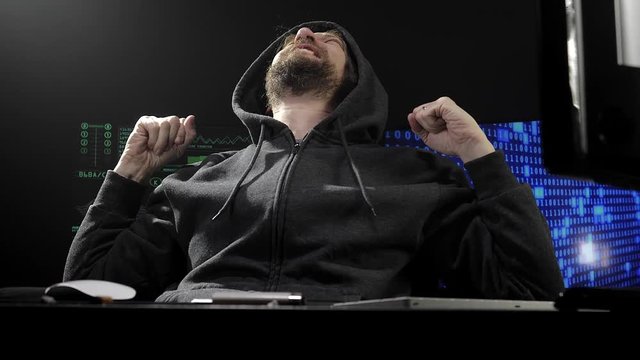 Cool hacker satisfied about creating virus saying yes slow motion