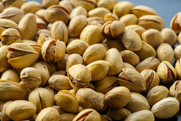 Pistachio nuts. A close-up photograph. Unrefined whole kernel 
