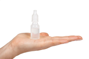 Medical eye dropper bottle, container with liquid in hand. Isolated on white background. Medicine solution