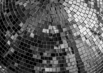 Reflections in a disco ball, black and white. Disco ball reflecting abstract, photo from below, party, disco concept.