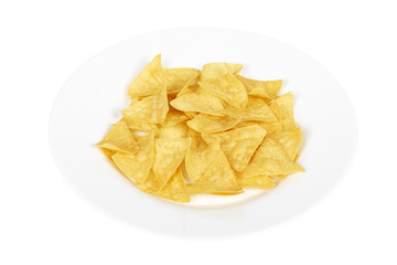 Corn chips, triangle nachos on plate. Isolated on white background. Fast food snack, mexiacan tortilla