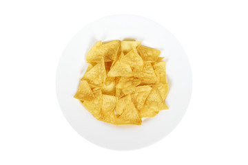 Corn chips, triangle nachos on plate. Isolated on white background. Fast food snack, mexiacan tortilla