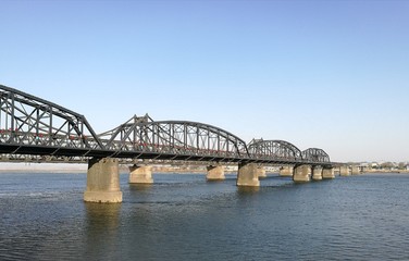 Fototapeta na wymiar Broken Bridge, Dandong, China (April, 2017) - opposite to Sinuiju city, North Korea; at Yalu river (natural border). It was bombed; repaired only part in China. Taken from public area in China.