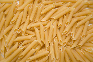 Fusilli Pasta texture background. Pasta is a staple food of traditional Italian cuisine.