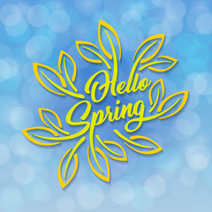 Hello Spring. Green stylized inscription decorated with foliage against the sky with a bokeh effect. Spring template for your design, cards, invitations, posters