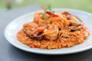 seafood risotto with mussel shrimp and squid , italian food