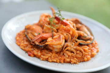 seafood risotto with mussel shrimp and squid , italian food
