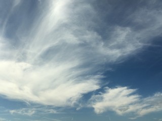 high clouds in pale blue winter sky