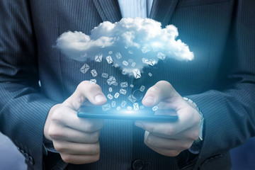 Businessman running with email in the cloud.