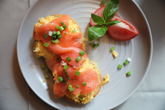 Scrambled eggs with smoked salmon on toast , Breakfast food