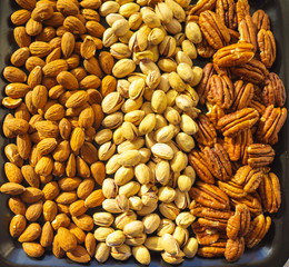 Nuts almonds, pistachios and pecans, close-up, set.  