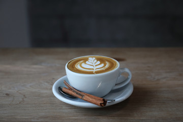 cappuccino or Latte art coffee made from milk on the wood table in coffee shop