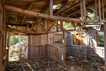Fototapeta na wymiar Old wooden cabin house destroyed by hurricane