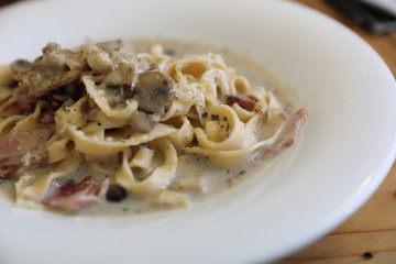 pasta fettuccine alfredo white sauce with ham bacon and mushroom