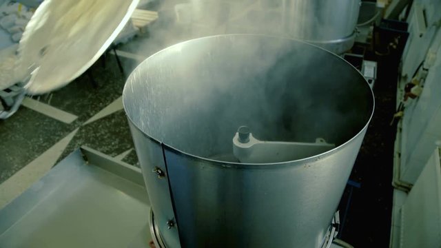 Process of cooking popcorn on the factory 4K