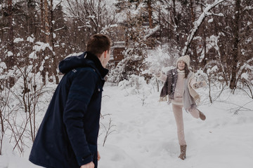 Happy Young Couple in Winter Park having fun.Family Outdoors. love