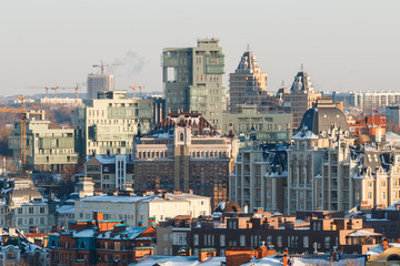Red and white classic factory pipe with city at background
