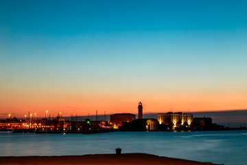 Colorful sunset in front of the city of Trieste