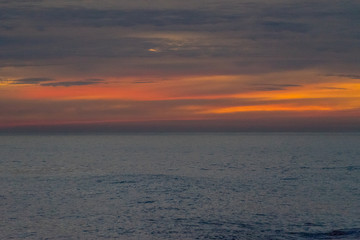landscape from a height overlooking the sea and a bright sunset.