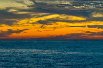 landscape from a height overlooking the sea and a bright sunset.