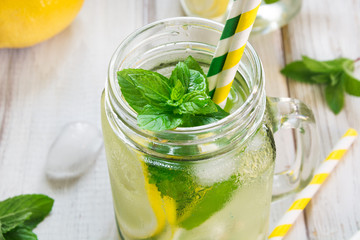 Summer refreshing detox cocktail. Water with lemon, mint and ice.