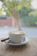 cappuccino or Latte art coffee made from milk on the wood table in coffee shop.