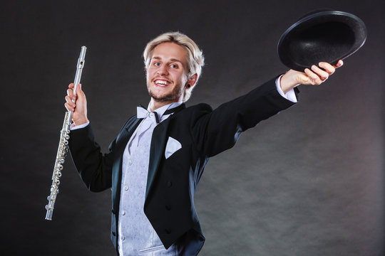 Elegantly dressed musician holding flute