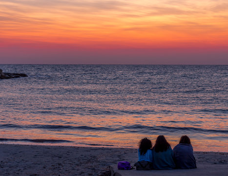 Three Friends Looking To The Sunrise