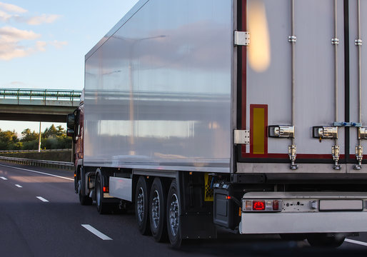 Truck with semitrailer moves along the road.