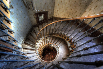 Urbex (urban exploration): Spiral staircase in an abandoned villa